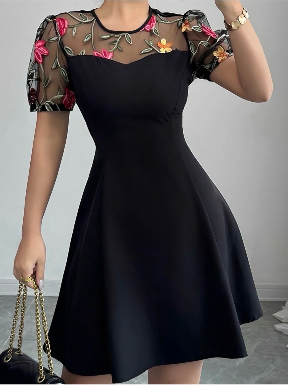 Elegant Black Fit-and-Flare Dress with Floral Mesh Yoke